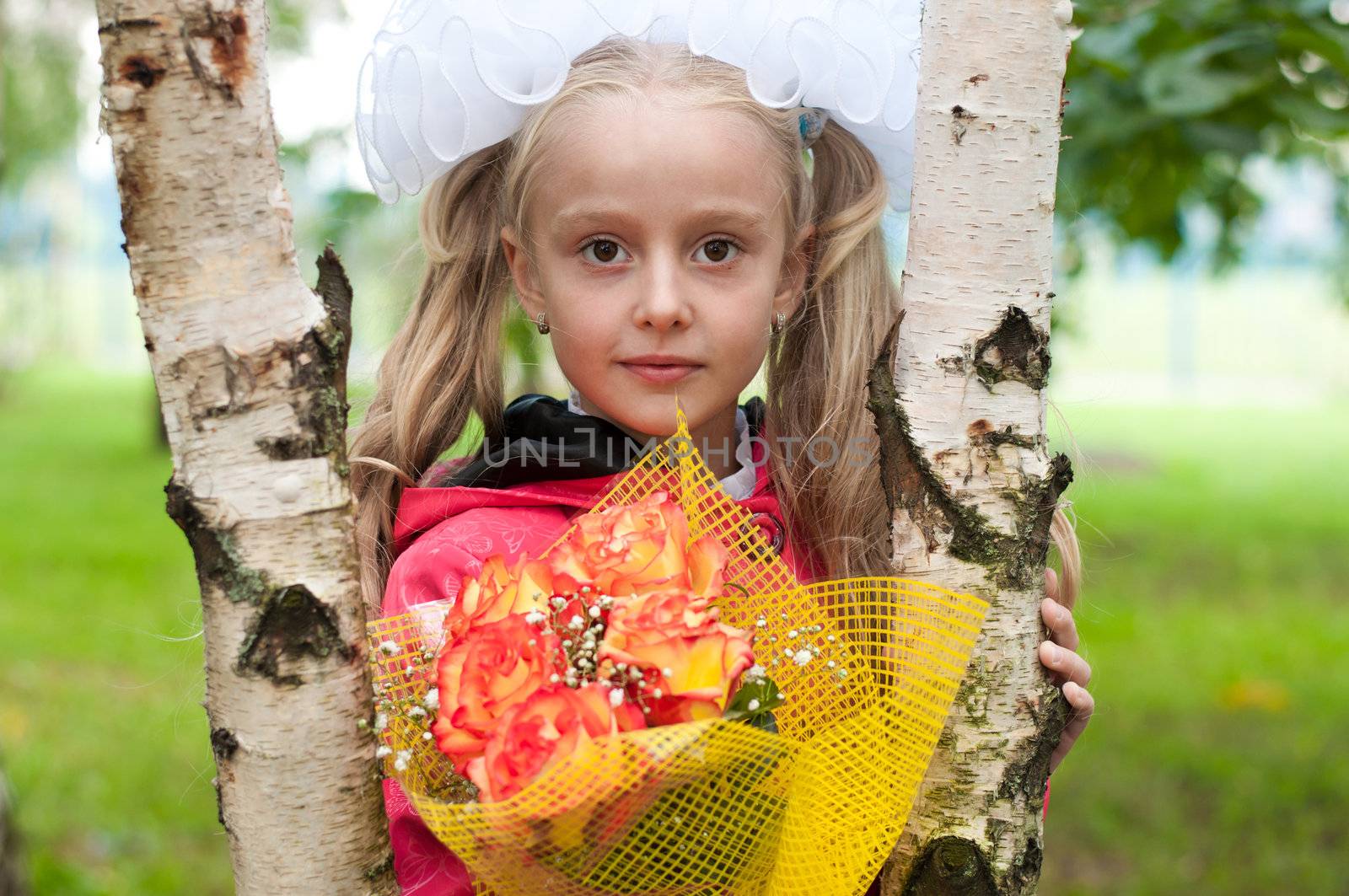 Schoolgirl dressed with a bouquet