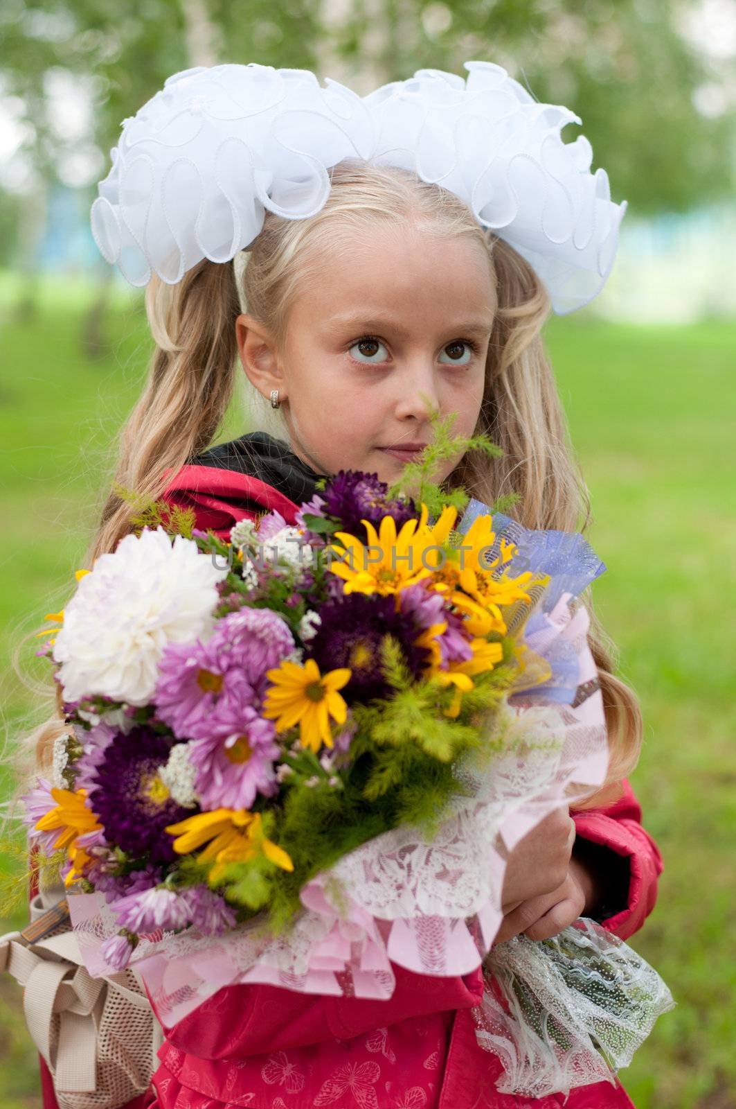 Schoolgirl dressed with a bouquet