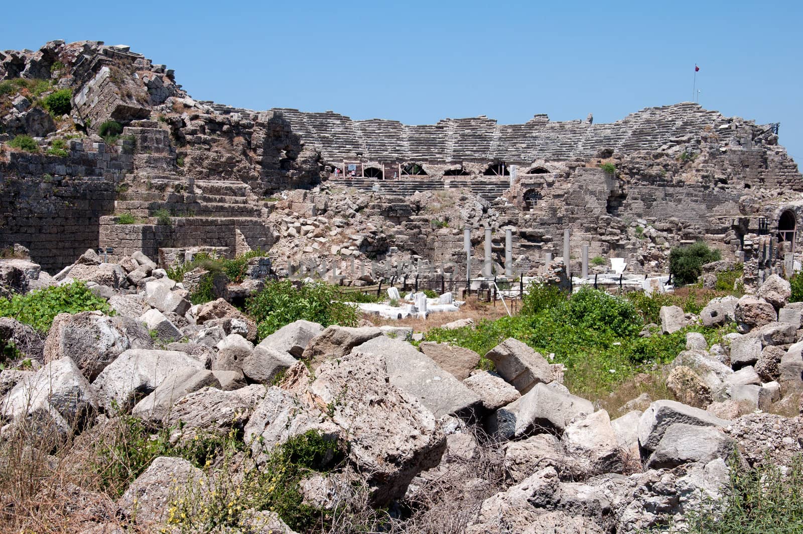 The ruins of the ancient amphitheater in Side, Turkey by olgavolodina