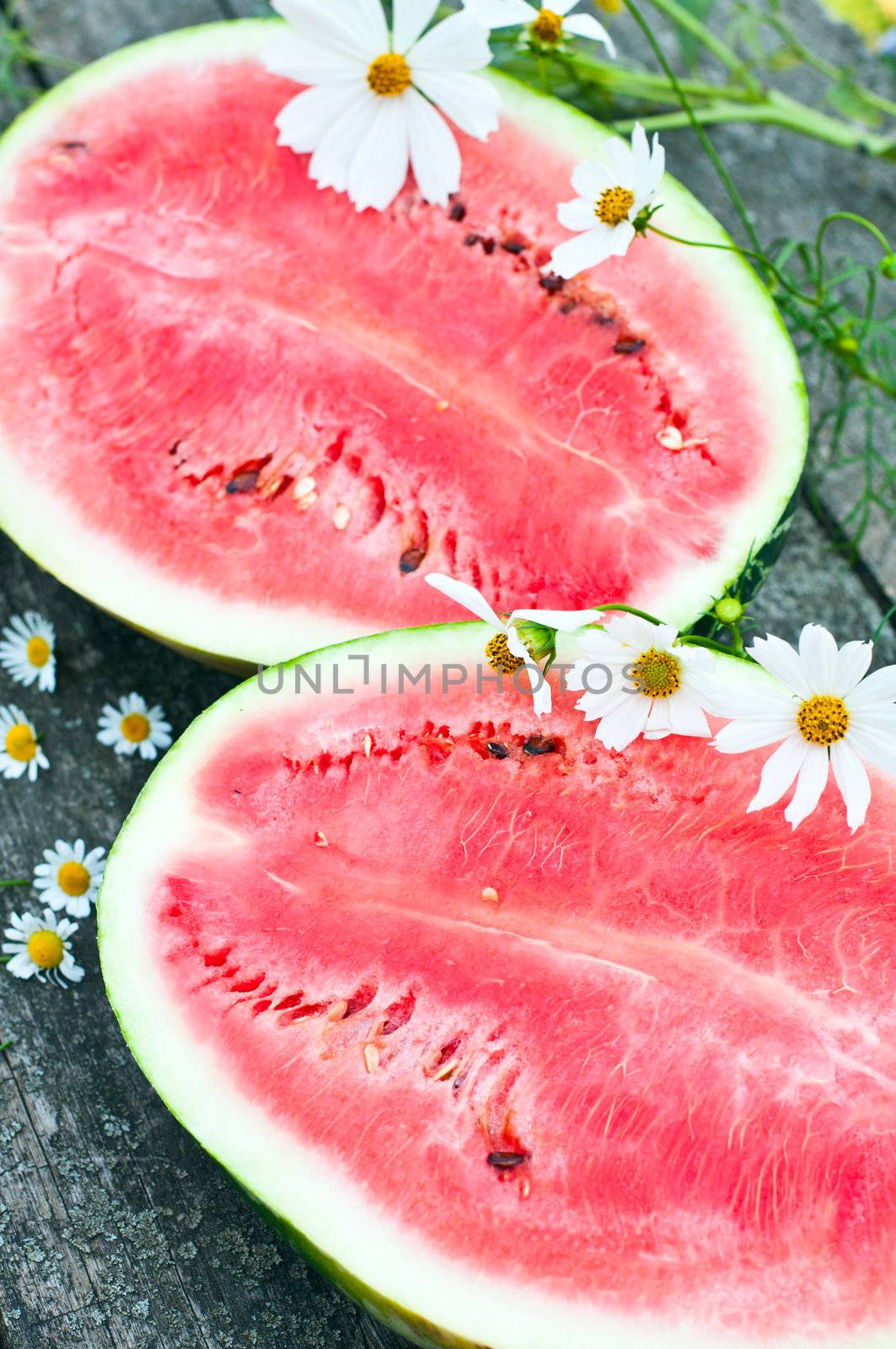 Appetizing ripe watermelon on the table by olgavolodina