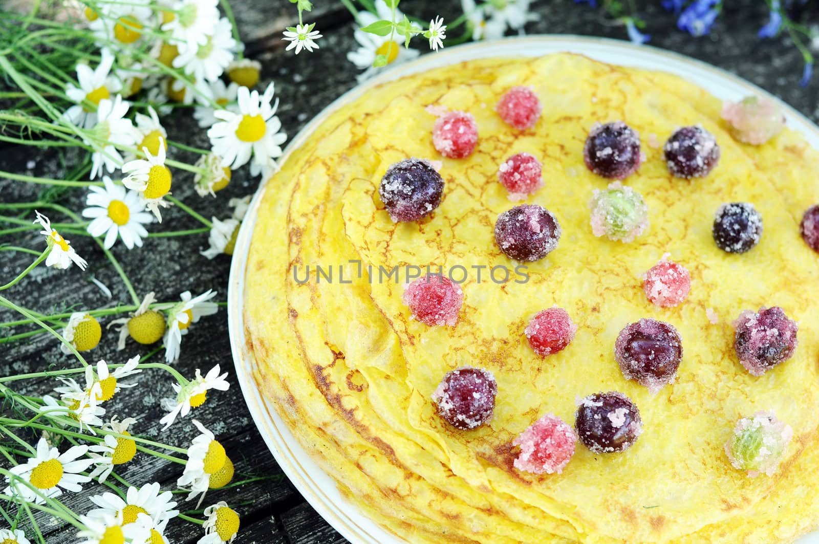 Delicious homemade pancakes with berries by olgavolodina