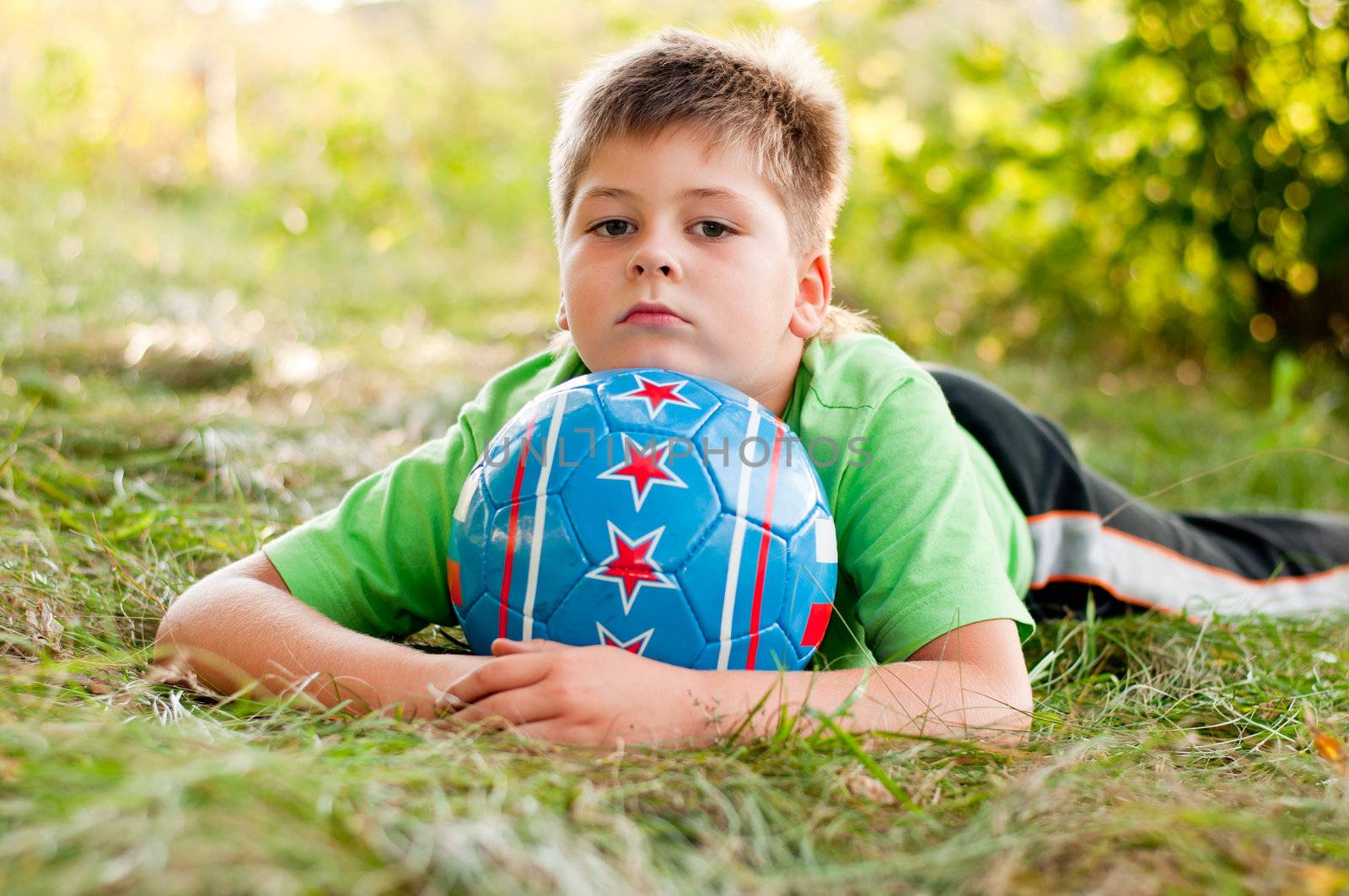 The boy with the ball on the nature