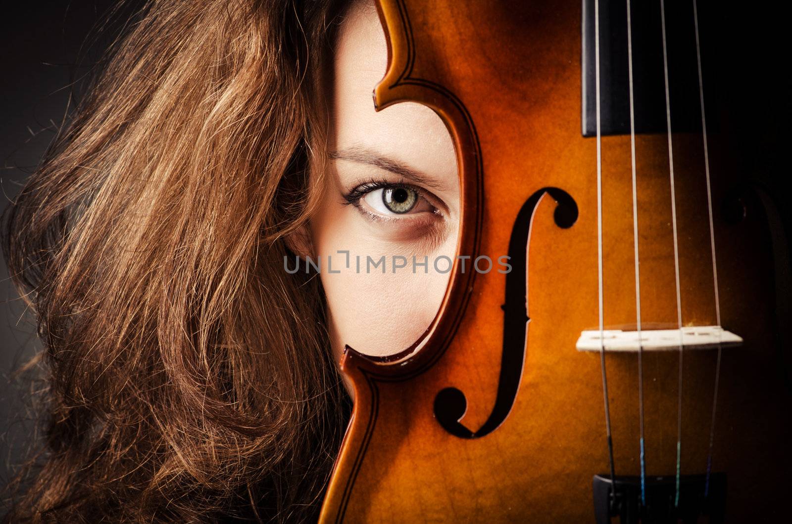 Woman with violin in dark room by Elnur