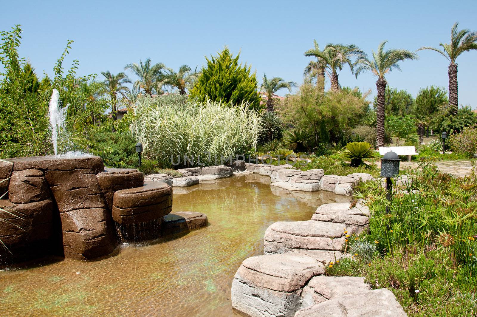 Landscaping - a stone fountain and pond