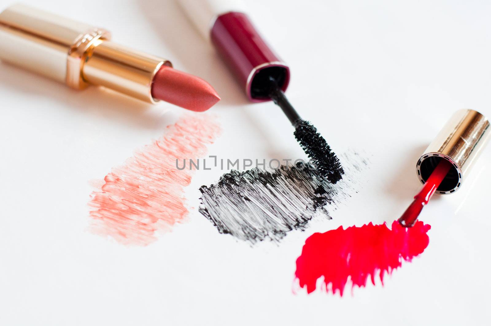 Feminine cosmetics on a light background by olgavolodina