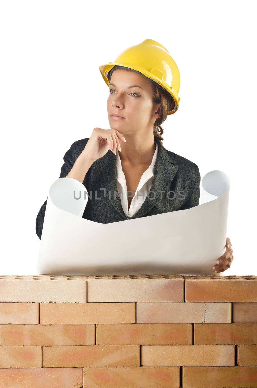 Businesswoman with drawings near brick wall by Elnur
