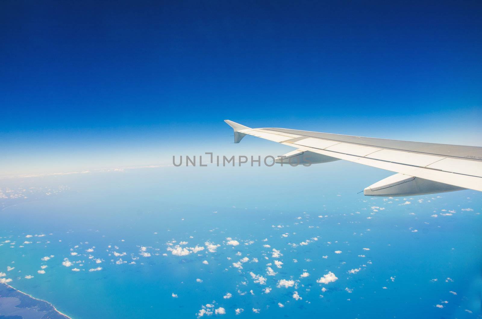 Airplane wing out of window by Elnur