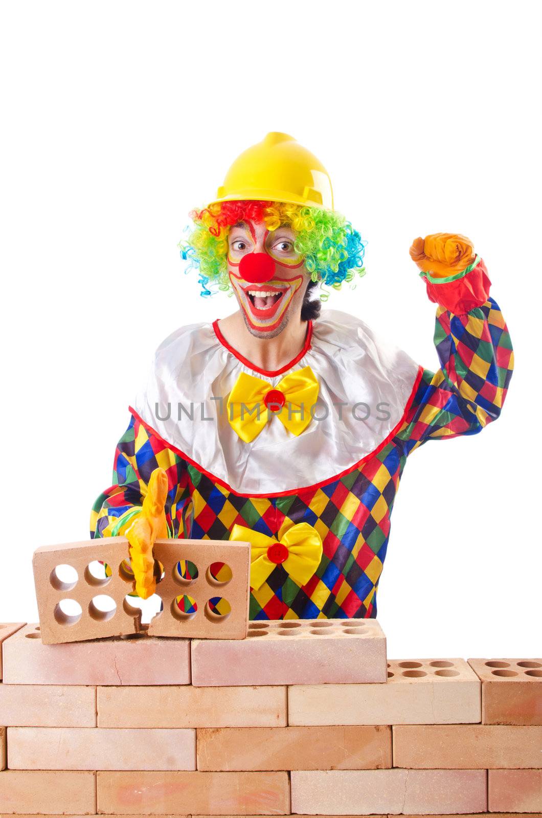 Bad construction concept with clown laying bricks by Elnur