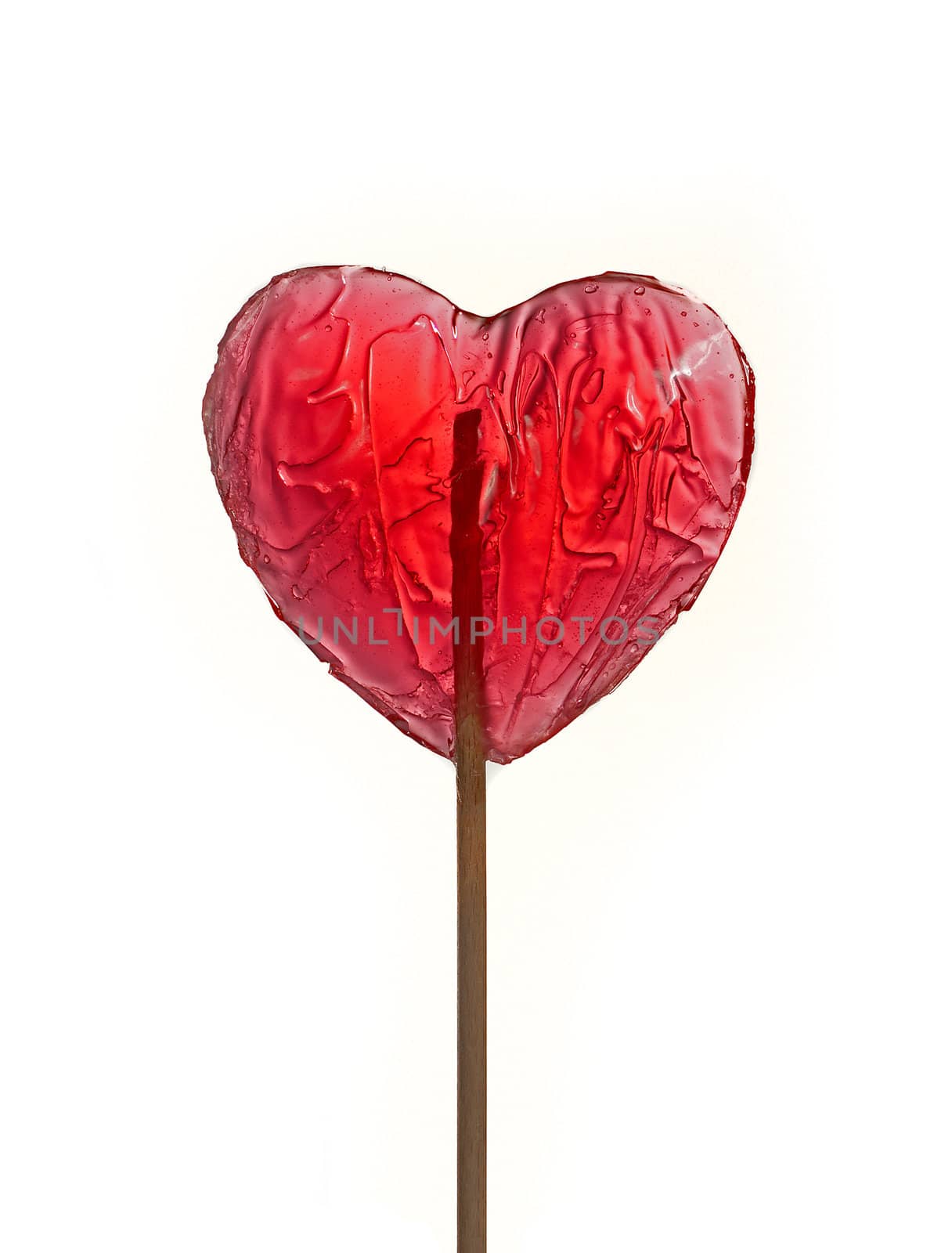 Heart shape red lollipop isolated over white background