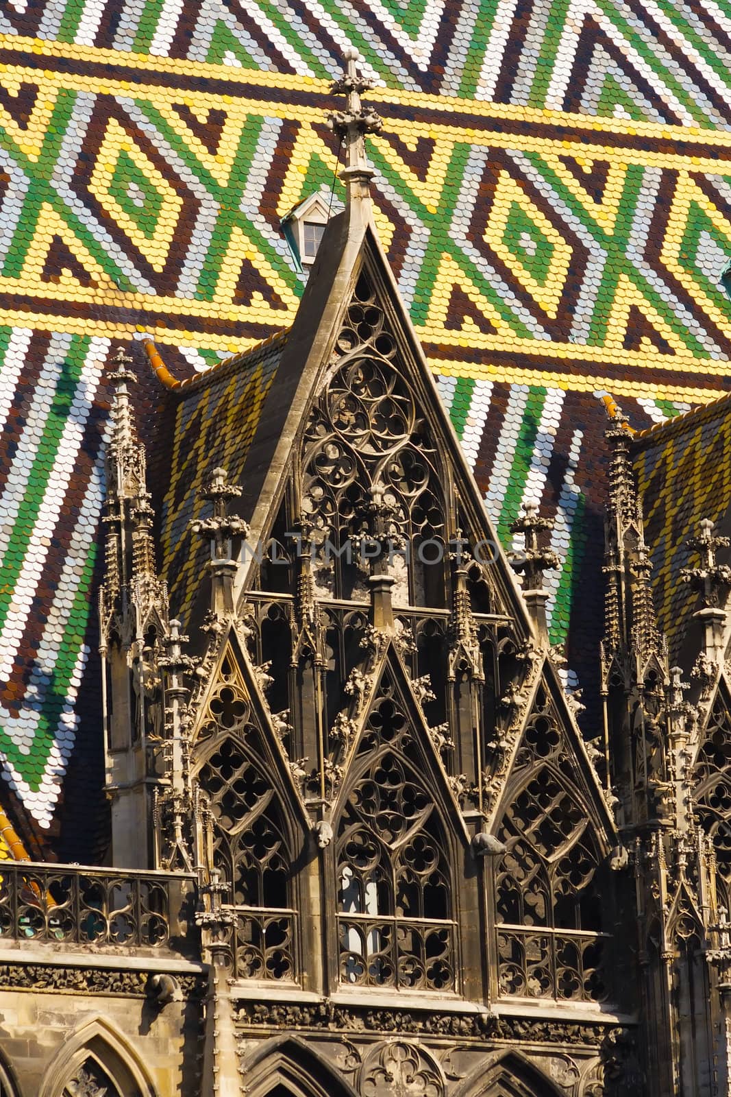 Detail of Vienna cathedral gothic architecture and patterned colorful roof