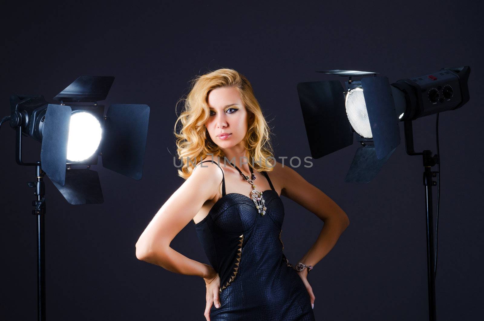 Young attractive woman in photo studio