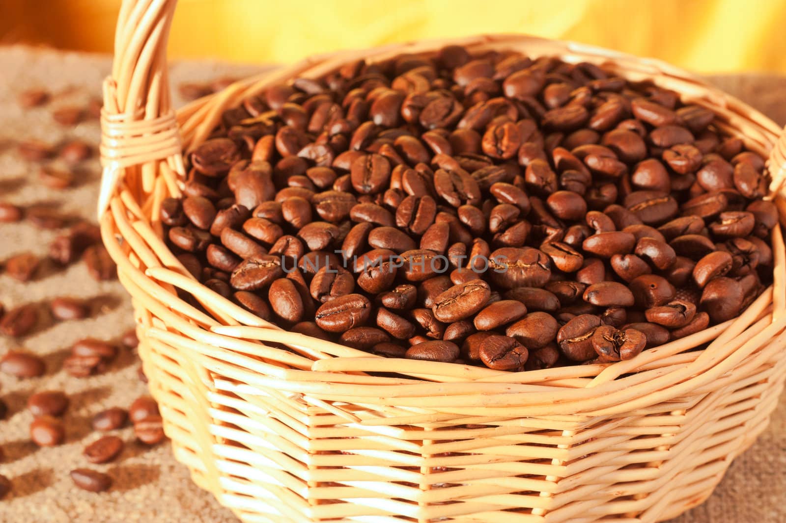 Roasted coffee beans in a wicker basket on the table