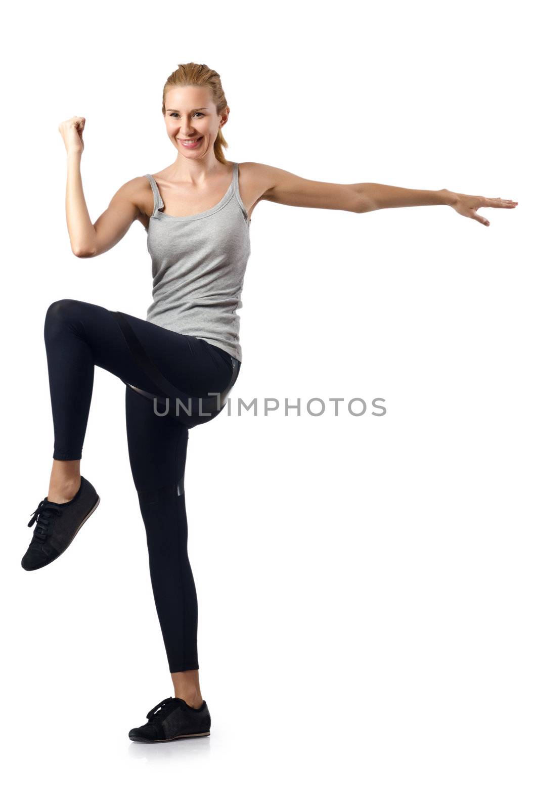 Woman doing exercises on white by Elnur