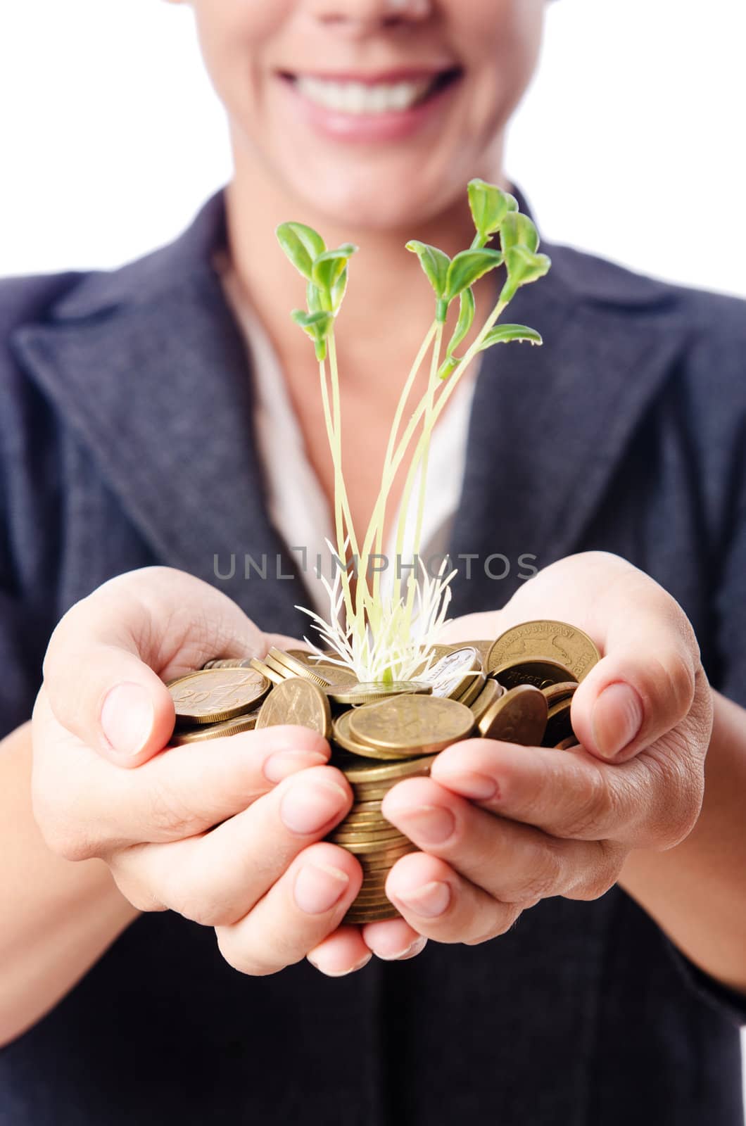 Businesswoman with seedlings and coins