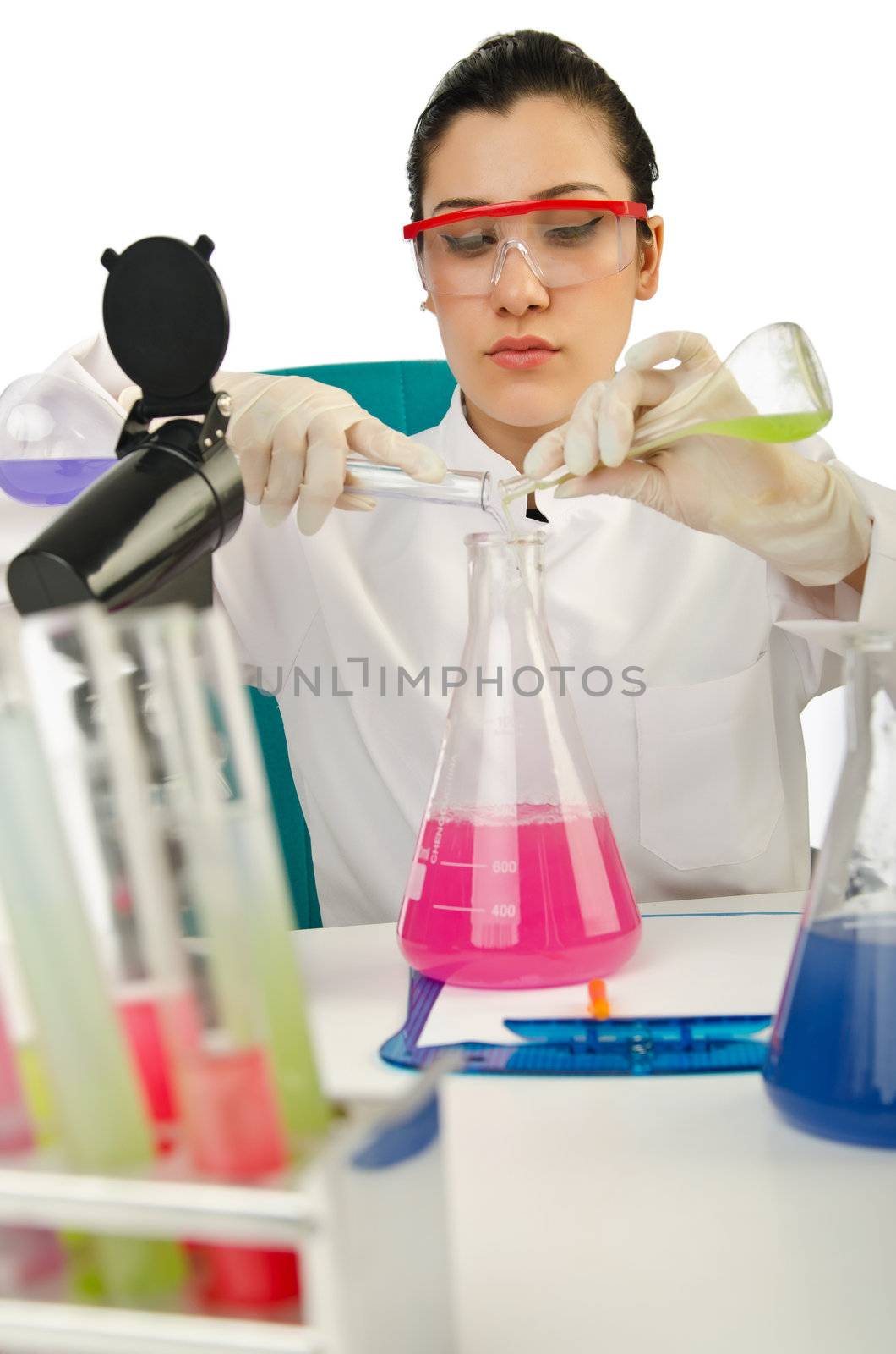 Female chemist in studio on white