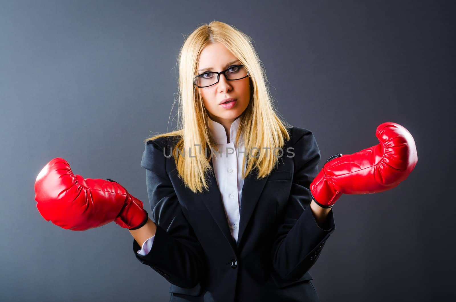 Woman boxer in dark room