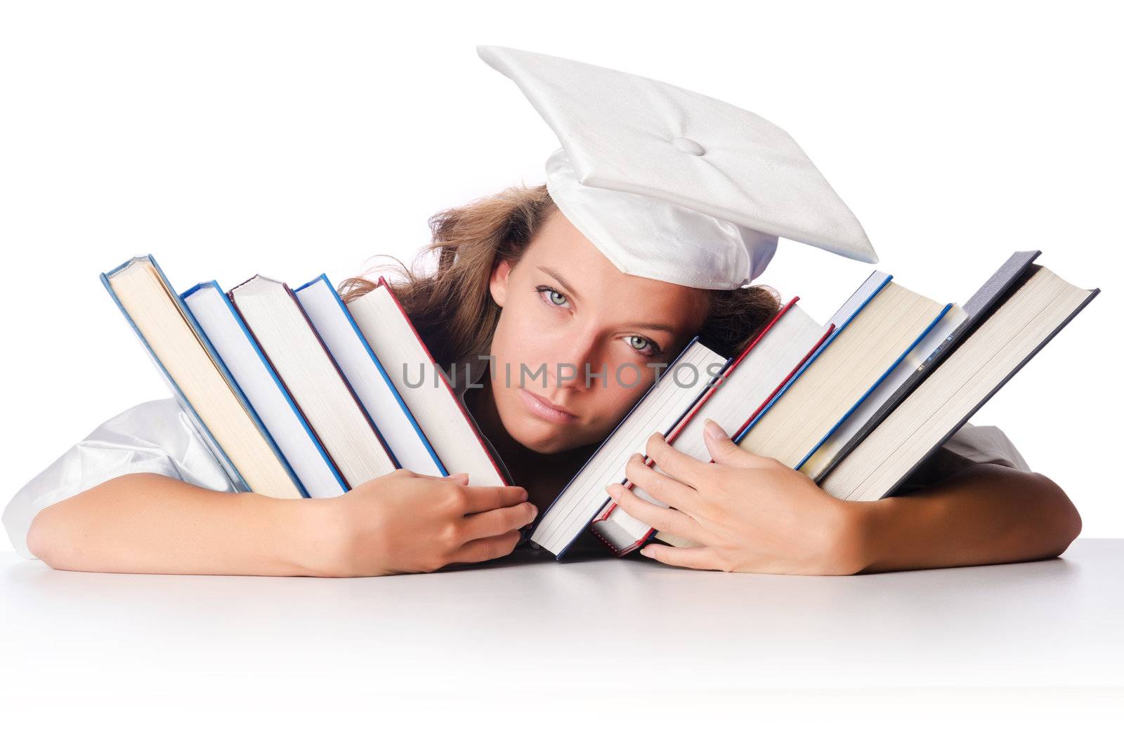 Happy graduate with lots of books on white