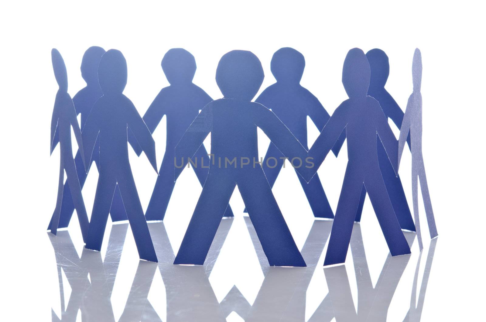 Teamwork concept with paper cut people by Elnur