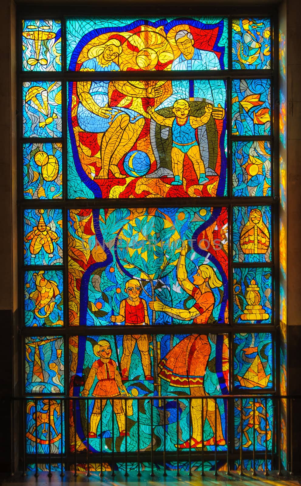Old stained-glass window with people. Made in USSR