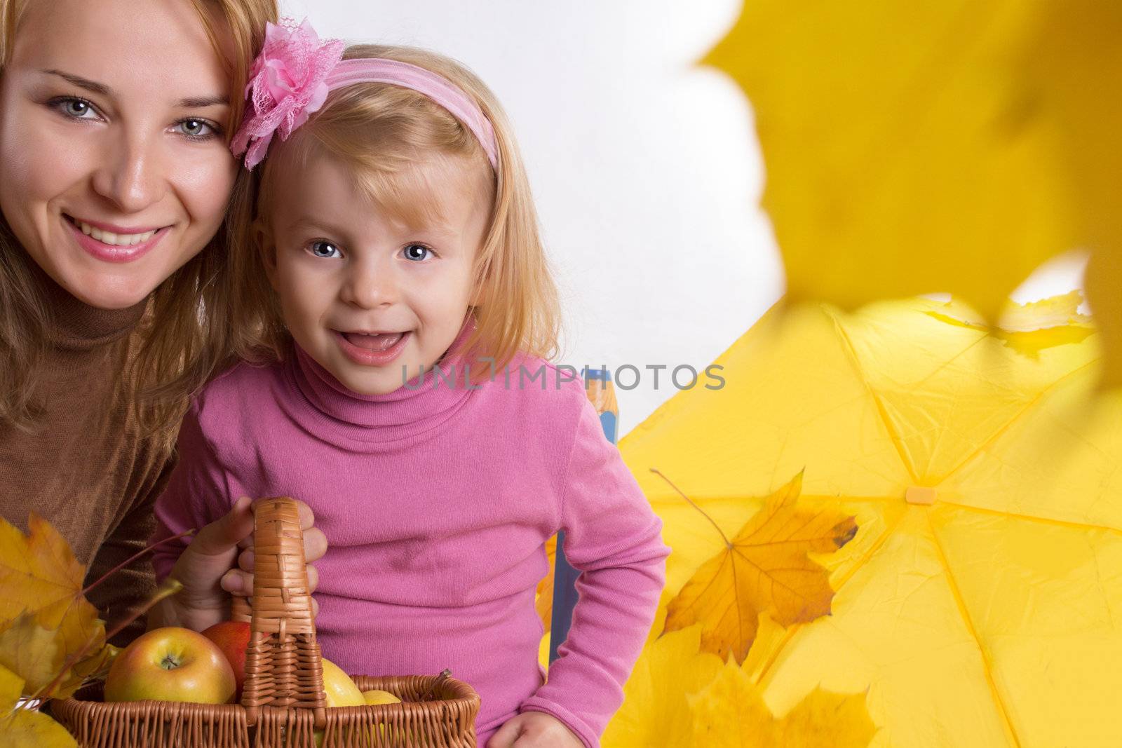 Mother and little daughter with basket and leaves by Angel_a
