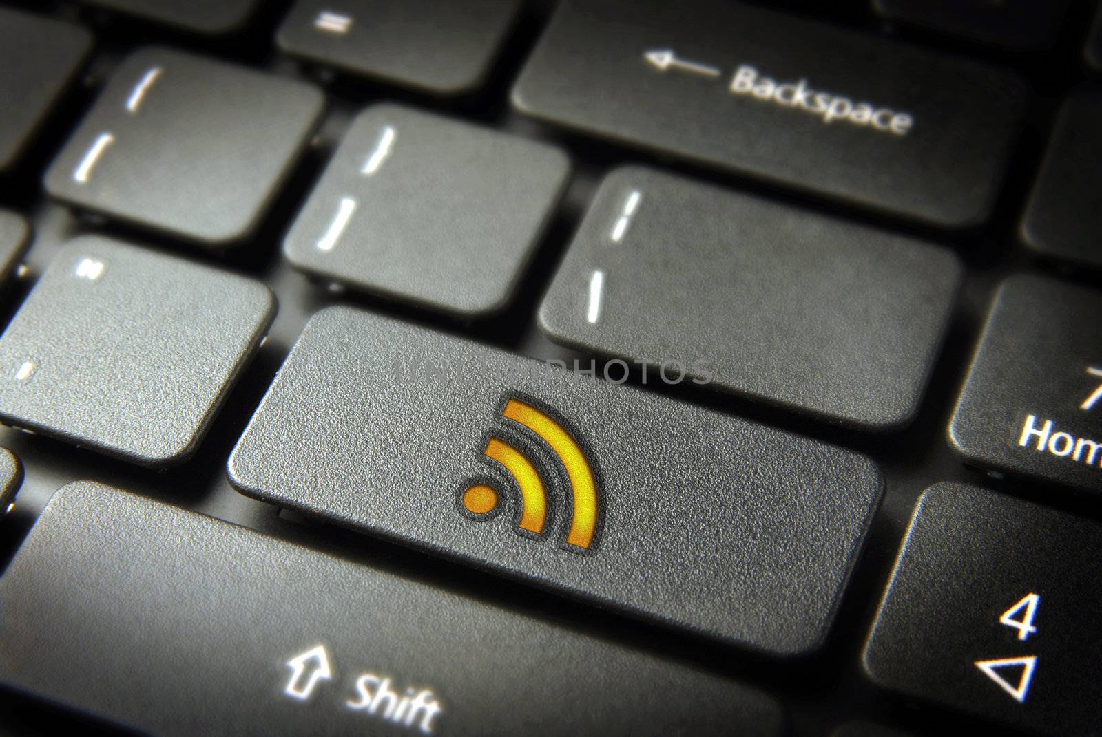Golden technology RSS icon key on laptop keyboard. Included clipping path, so you can easily edit it.