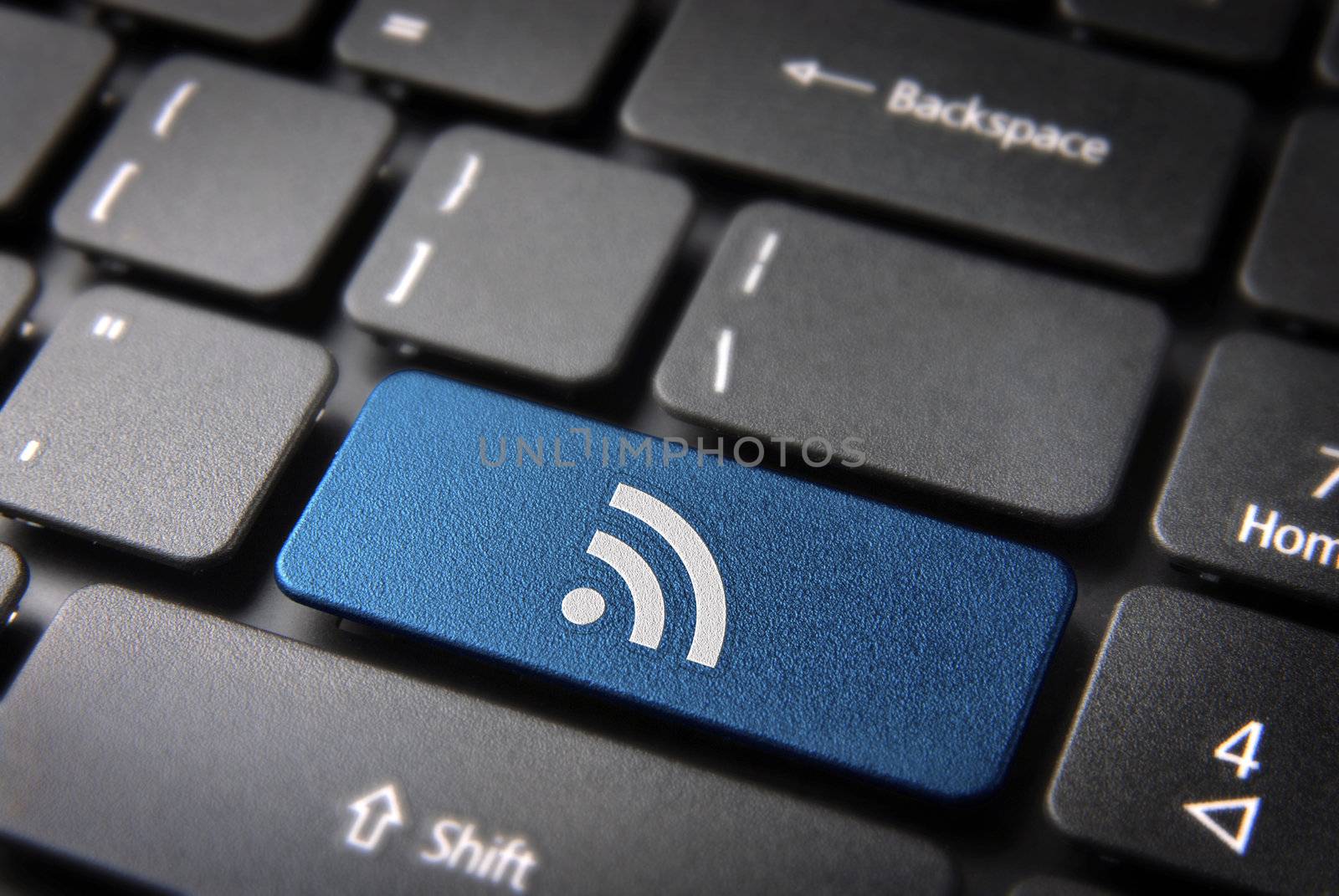 Blue keyboard key RSS icon, internet technology background by cienpies