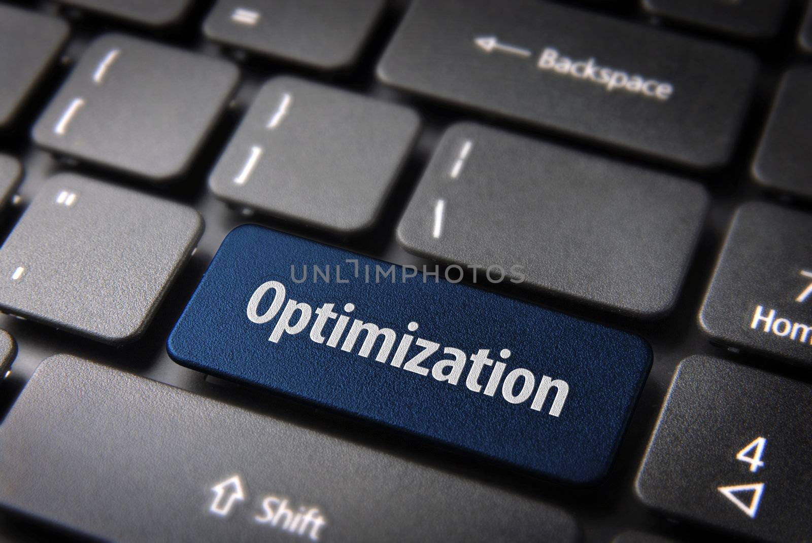 Blue key with Optimization word on laptop keyboard. Included clipping path, so you can easily edit it.