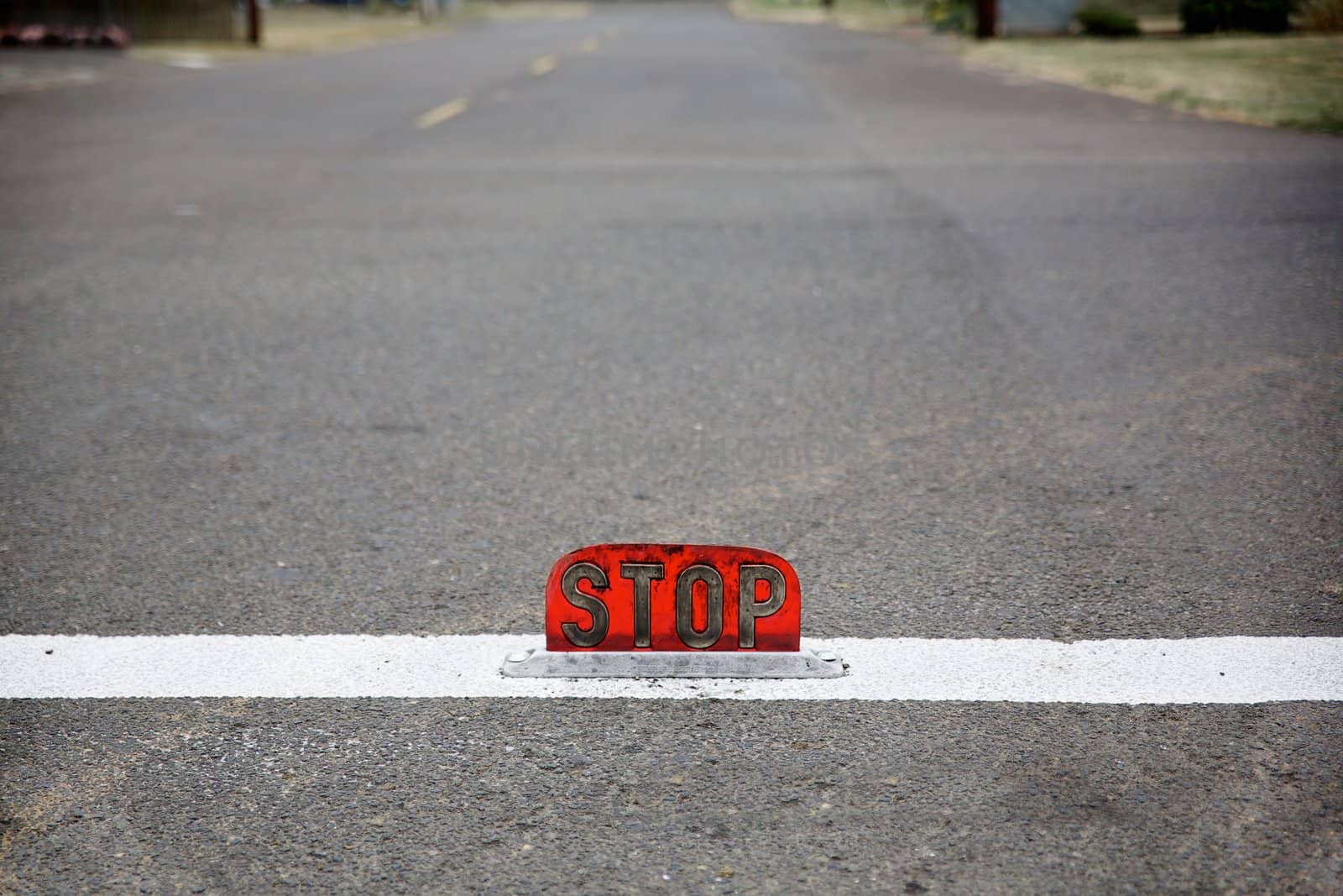 Old style street level stop sign with shallow dof by bobkeenan