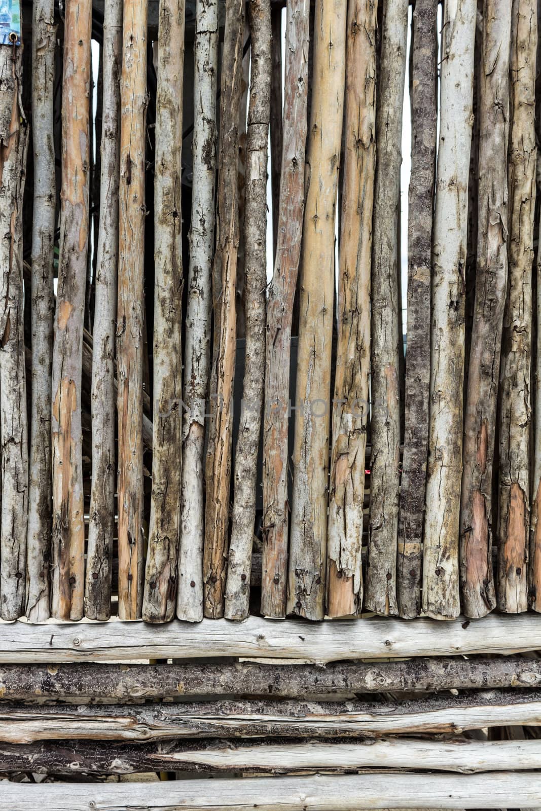 Traditional wooden rural wall from old logs