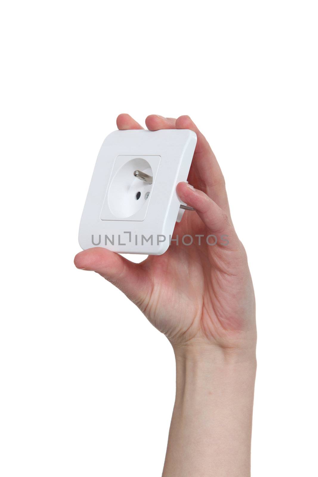 Hand holding a European electric socket by phovoir