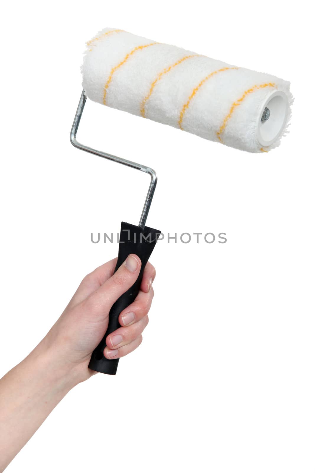 Hand holding a paint roller by phovoir
