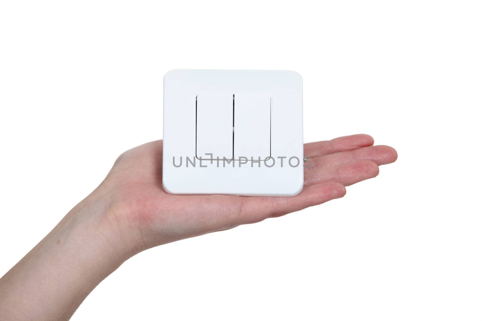 Hand of a woman holding a switch by phovoir