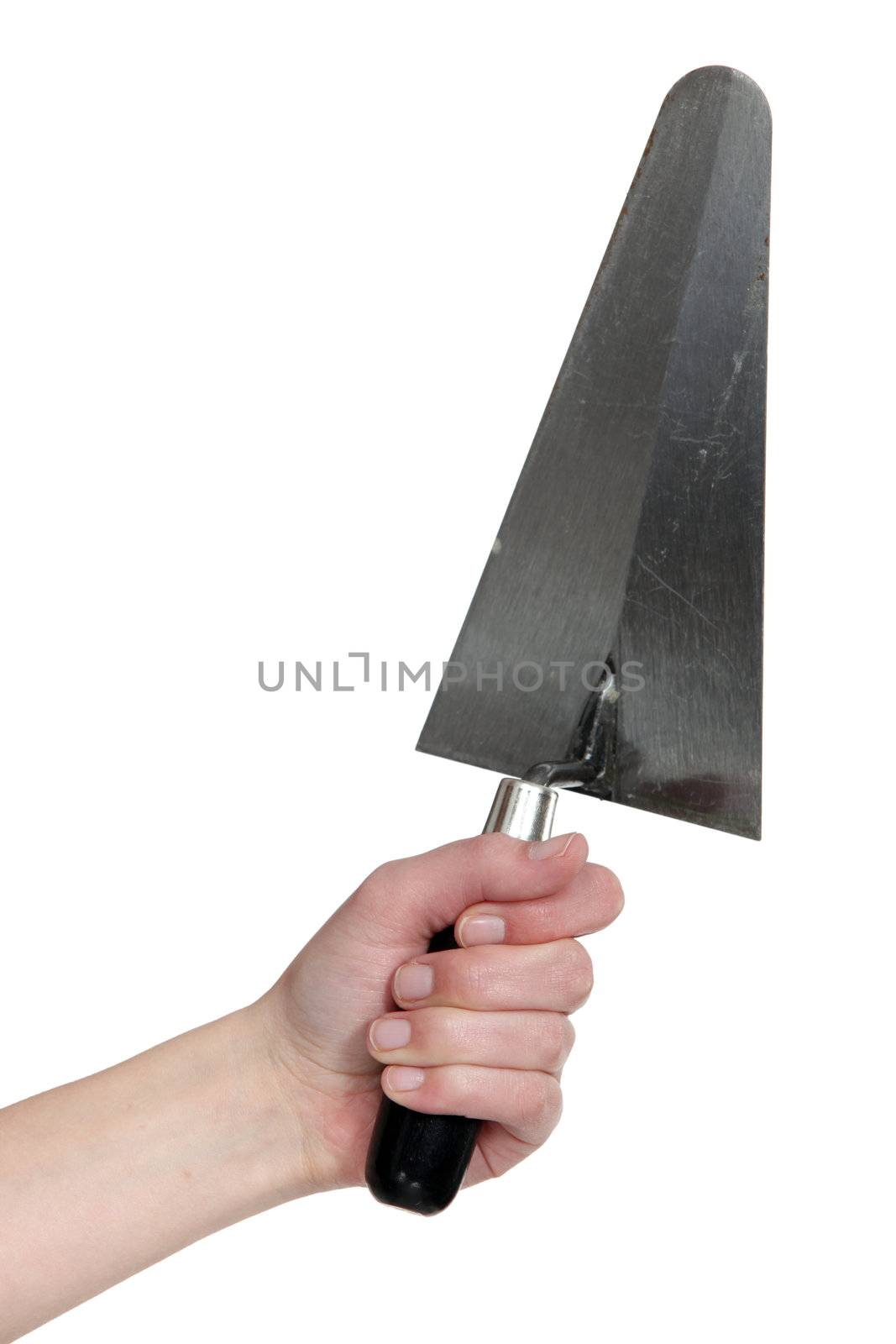 A hand holding a trowel.