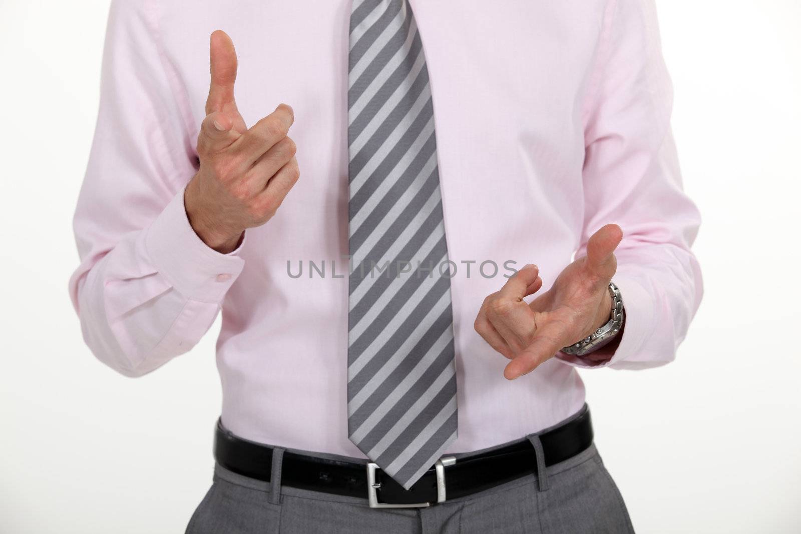 A businessman counting with his finger.