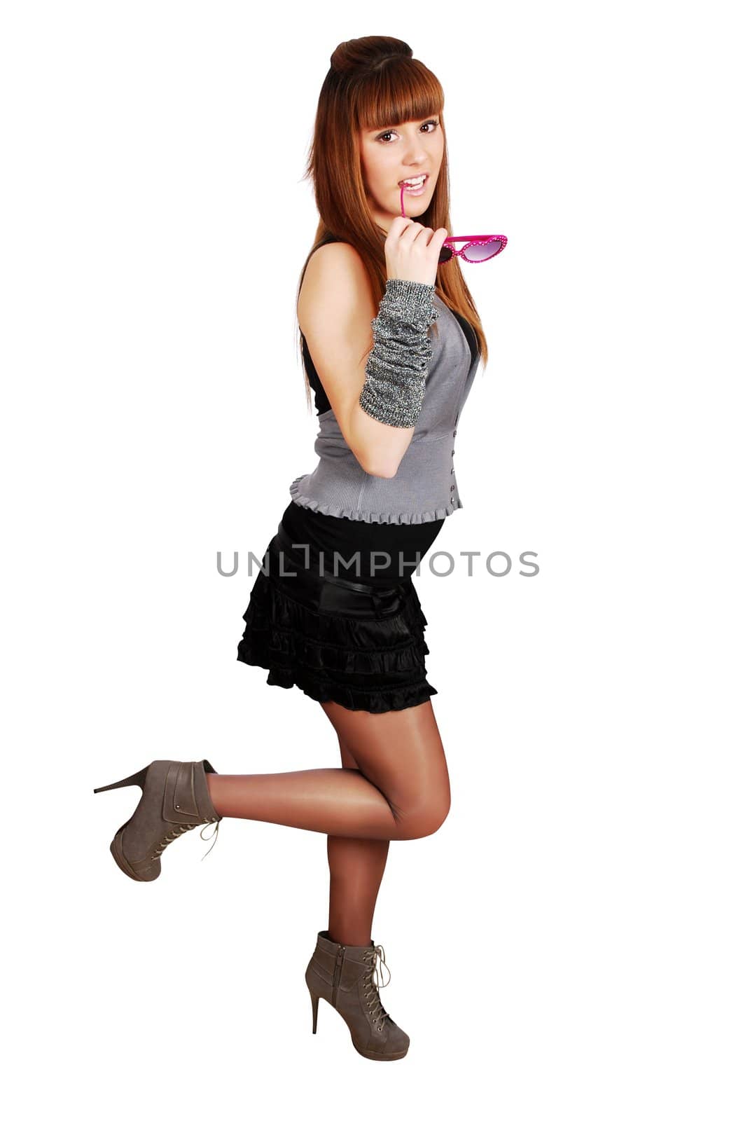 Teenage girl with sunglasses posing studio shot