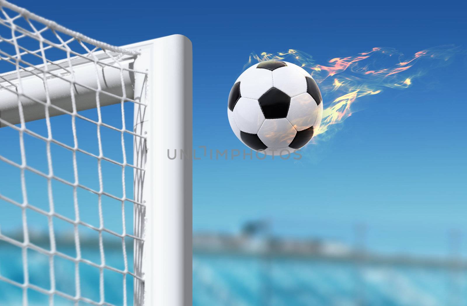 fiery football flies in goalkeeper gate on stadium