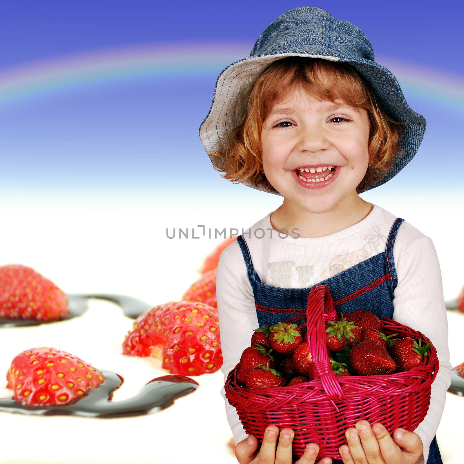 happy little girl with strawberries