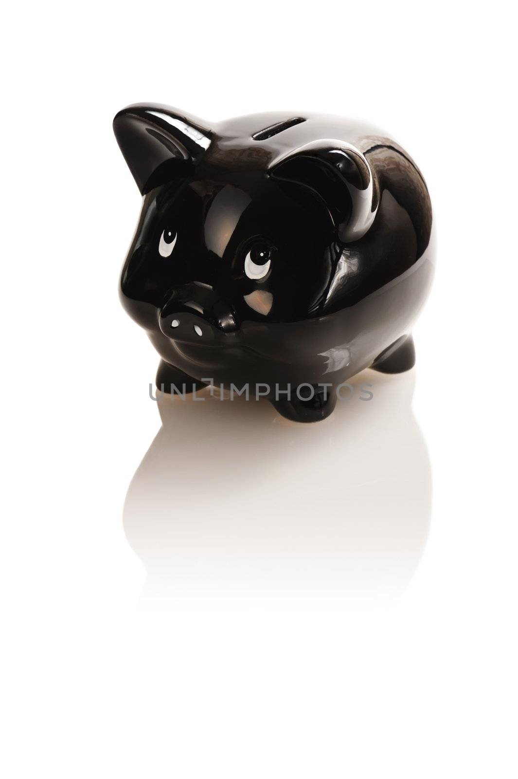 Black piggy bank isolated on white with soft reflection