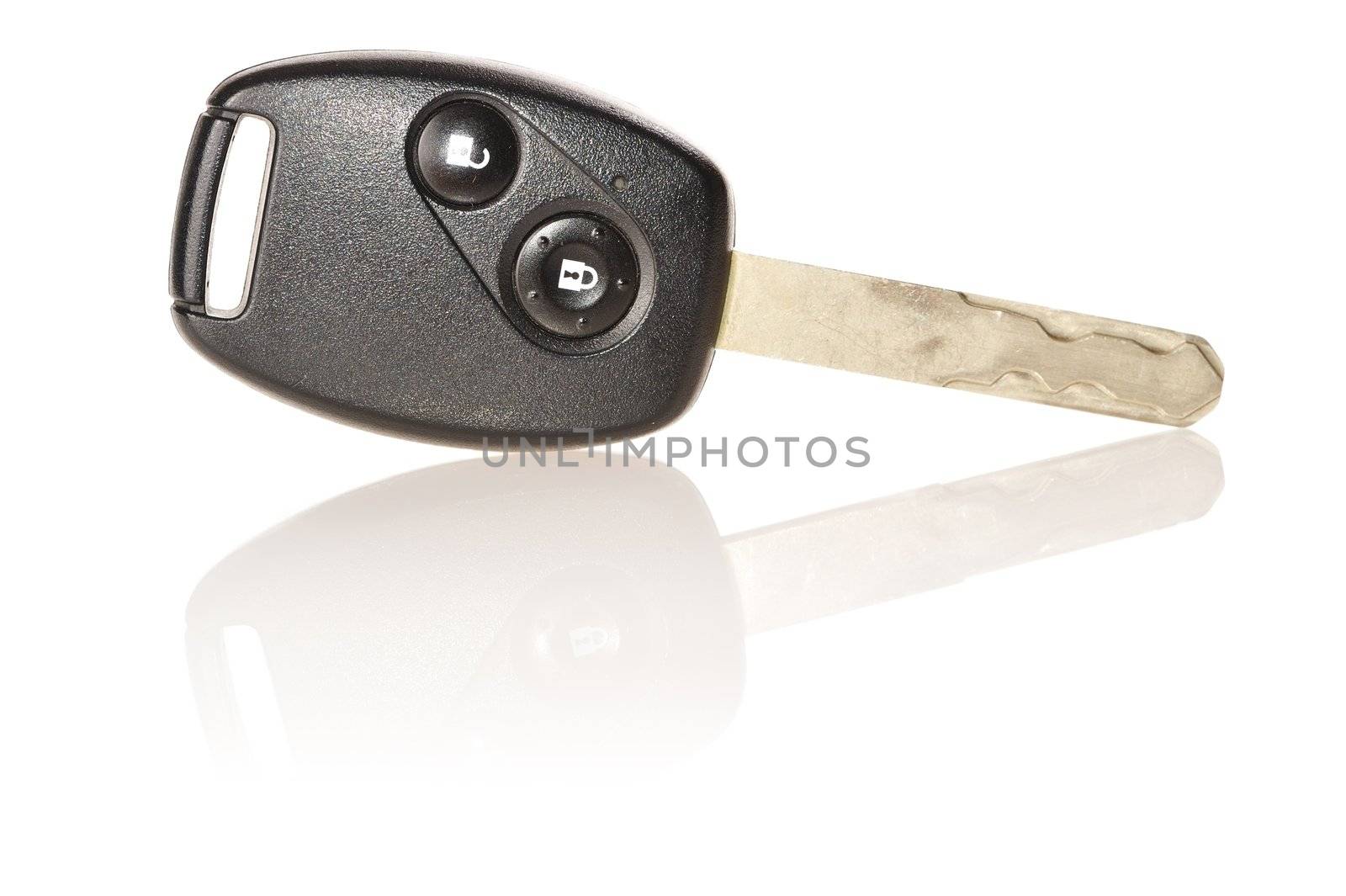 Car key isolated on white with soft reflection