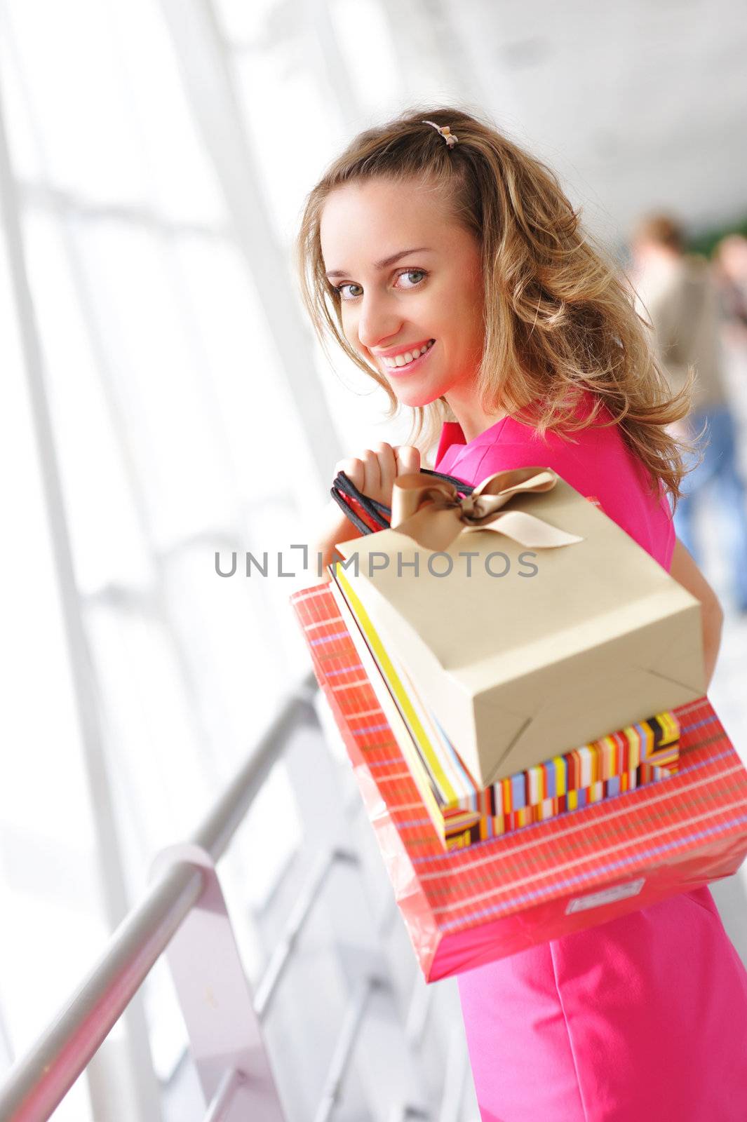 Woman with bags in shopping mall