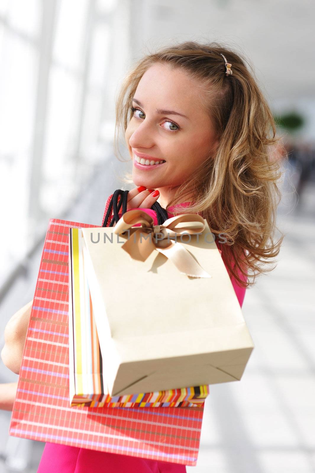 Woman with bags in shopping mall