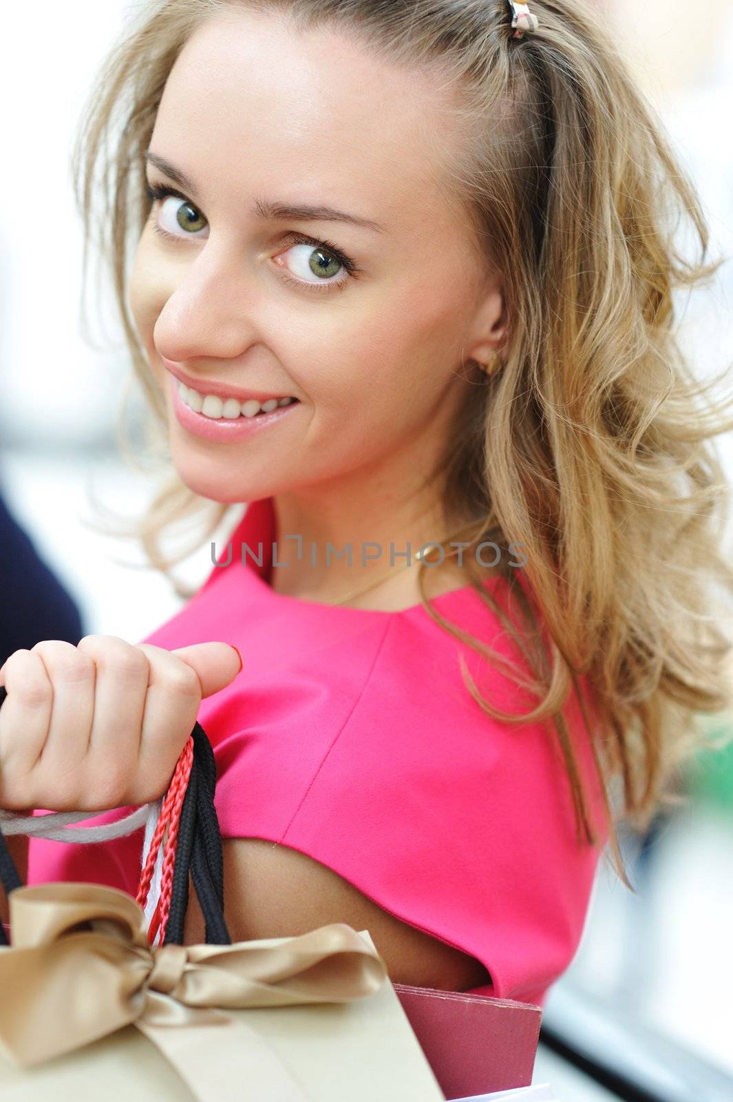 Woman with bags in shopping mall