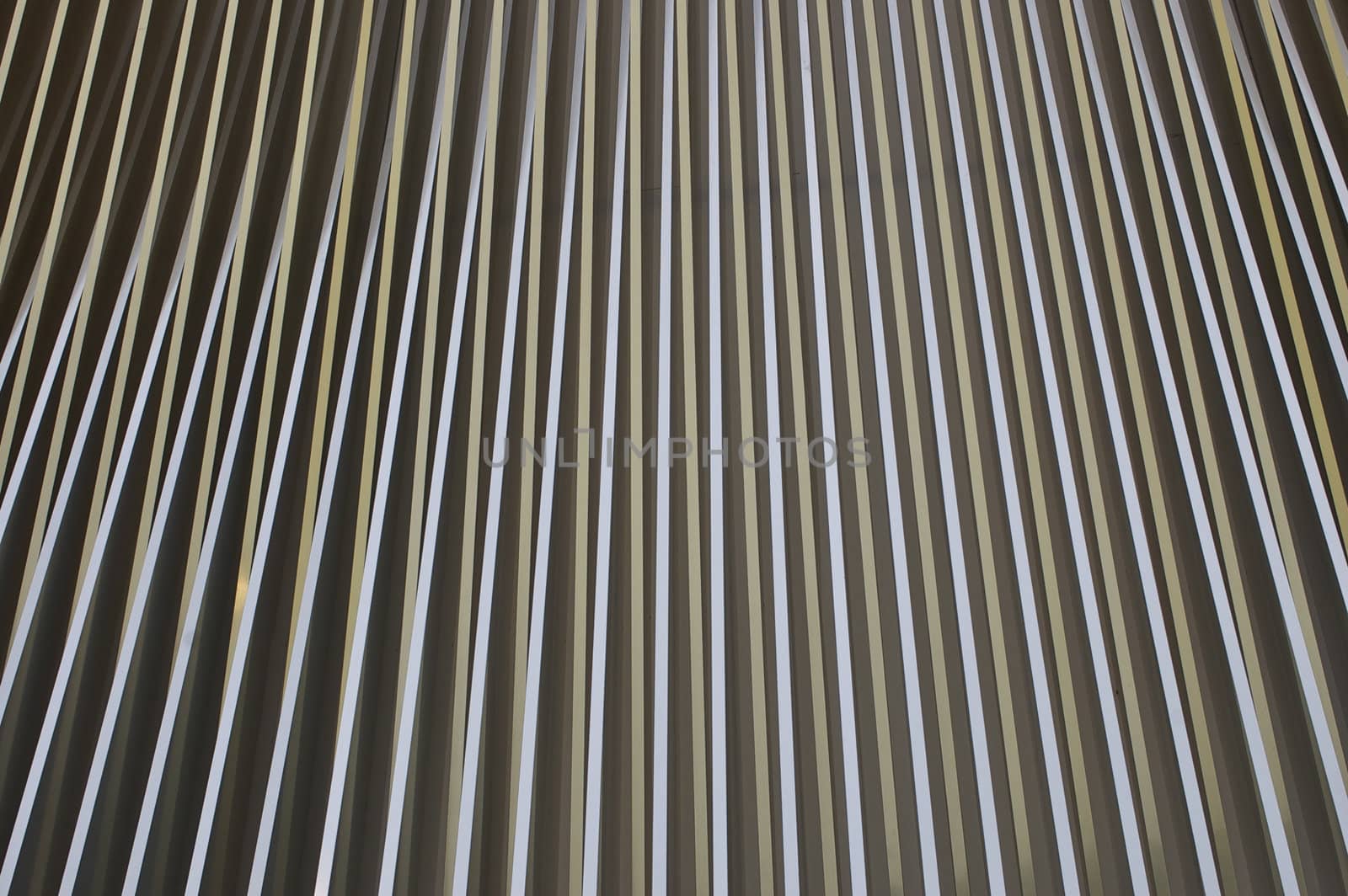 Full frame abstract image of different coloured lines or stripes, at points creating a visual 'blur' as they appear to converge, with copy space.  Perfect as a background or wallpaper.