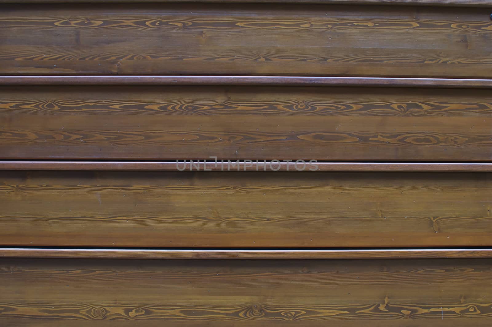 Full frame of narrow wooden wall panels perfect for use as an abstract background, or wallpaper with copy space.