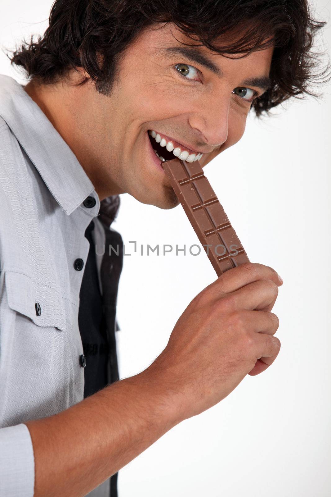 man eating chocolate by phovoir
