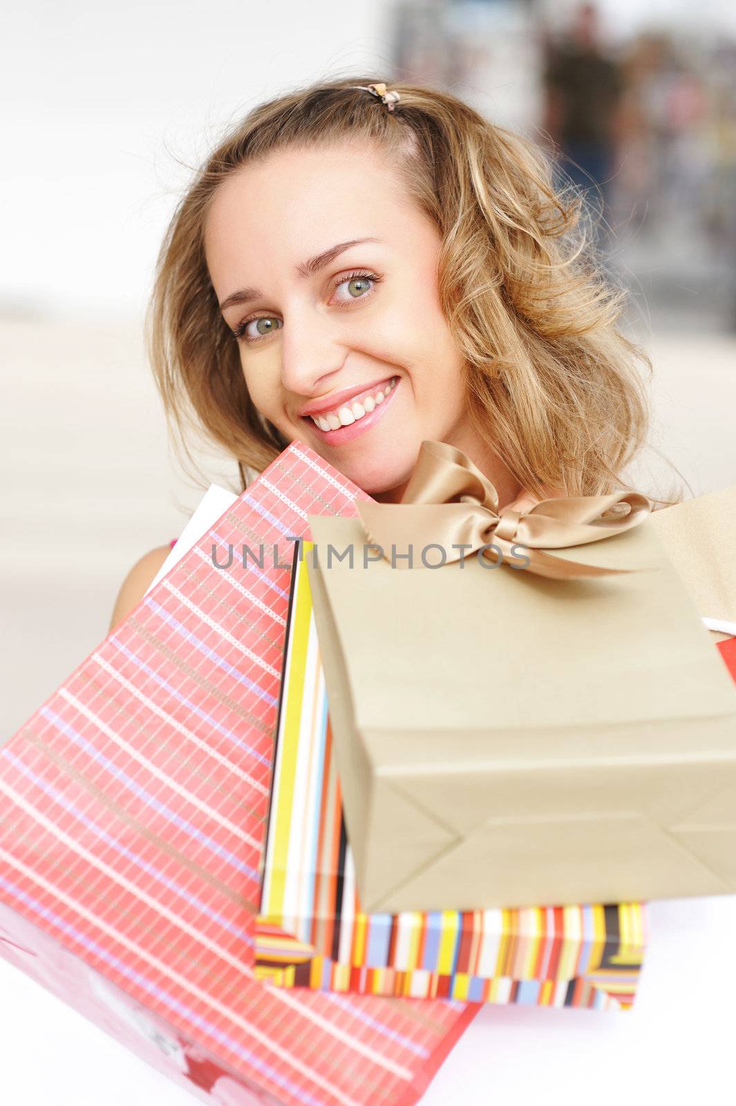 Woman with bags in shopping mall