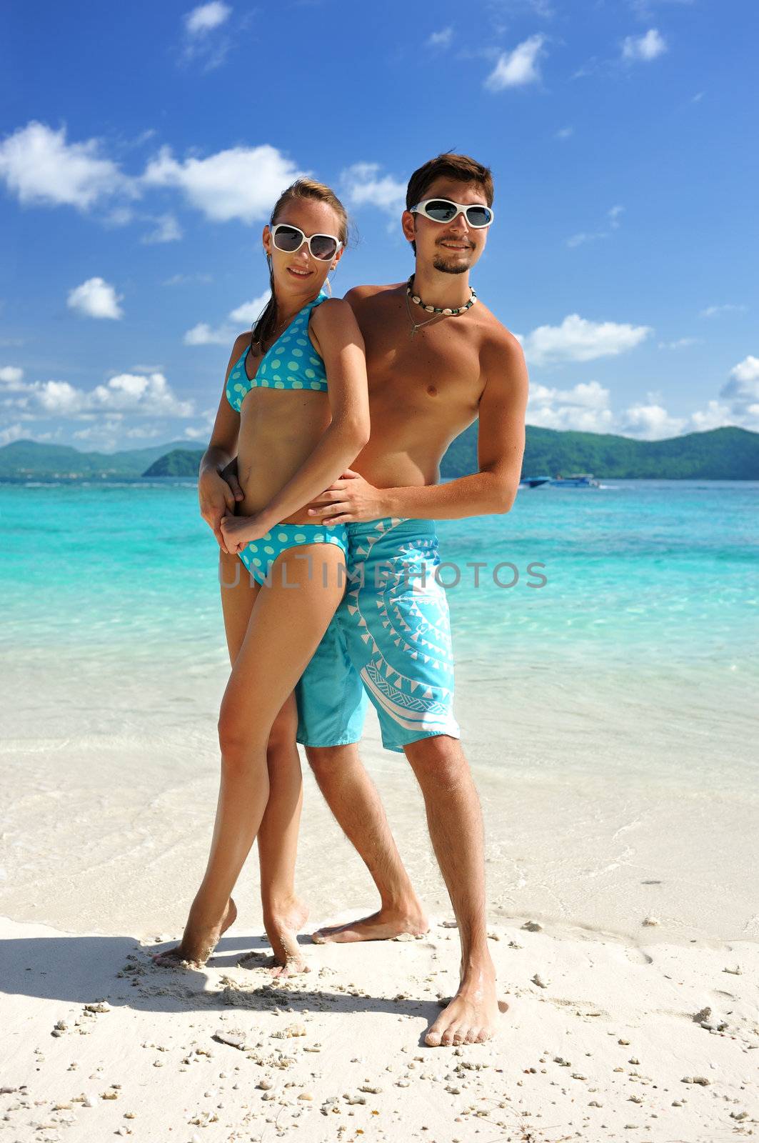 Couple on a beach by haveseen