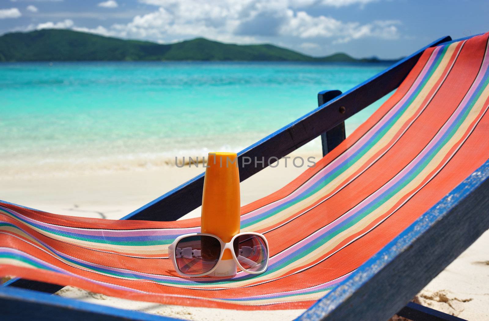 Sunscreen lotion on a beautiful beach 
