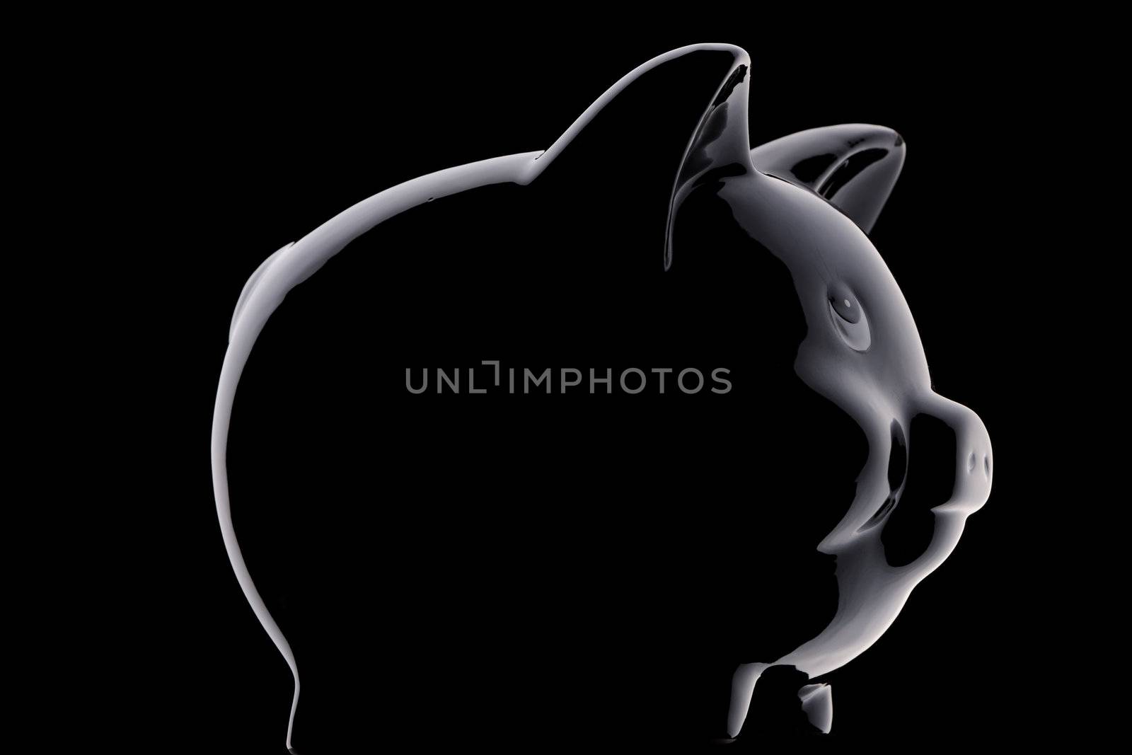 Piggy bank silhouette over black