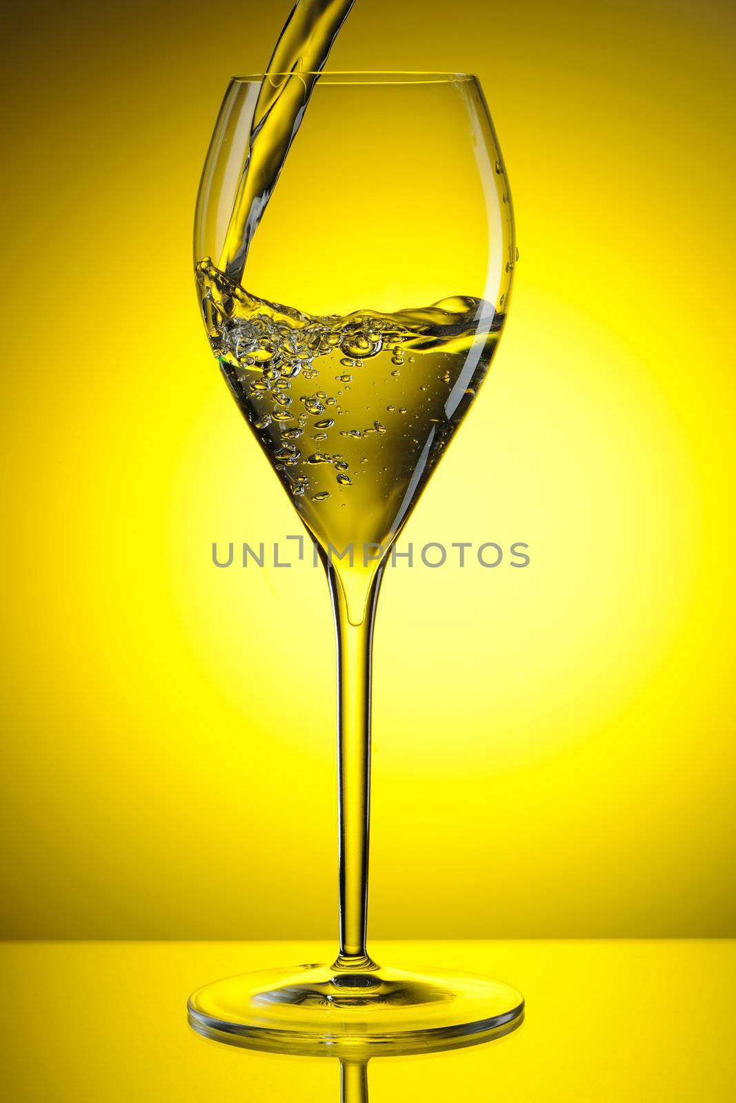 Pouring white wine into a glass